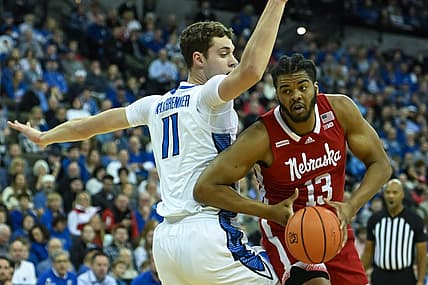 Dec 4, 2022; Omaha, Nebraska, USA; Nebraska Cornhuskers forward Derrick Walker (13) scores against Creighton Bluejays center Ryan Kalkbrenner (11) in the first half at CHI Health Center Omaha. Mandatory Credit: Steven Branscombe-USA TODAY Sports