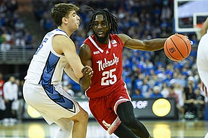 Dec 4, 2022; Omaha, Nebraska, USA; Nebraska Cornhuskers guard Emmanuel Bandoumel (25) drives against Creighton Bluejays guard Francisco Farabello (5) in the first half at CHI Health Center Omaha. Mandatory Credit: Steven Branscombe-USA TODAY Sports