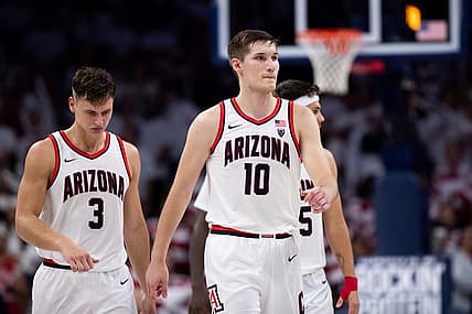 Dec 4, 2022; Tucson, Arizona, USA; Arizona Wildcats forward Azuolas Tubelis (10), guard Pelle Larsson (3), and  guard Kerr Kriisa (25) walk back to the bench during the second half against the Cal Golden Bears at McKale Center. Mandatory Credit: Zachary BonDurant-USA TODAY Sports