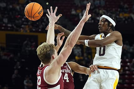 Dec 4, 2022; Tempe, Arizona, USA; Arizona State Sun Devils guard DJ Horne (0) passes the ball by Stanford Cardinal defenders during the second half at Desert Financial Arena. Mandatory Credit: Joe Camporeale-USA TODAY Sports