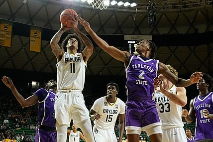 Dec 6, 2022; Waco, Texas, USA;  Baylor Bears forward Jalen Bridges (11) looks to score against Tarleton Texans guard Freddy Hicks (2) during the first half at Ferrell Center. Mandatory Credit: Chris Jones-USA TODAY Sports