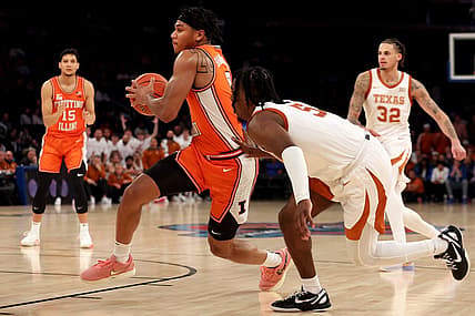 Dec 6, 2022; New York, New York, USA; Illinois Fighting Illini guard Terrence Shannon Jr. (0) drives to the basket against Texas Longhorns guard Marcus Carr (5) during the second half at Madison Square Garden. Mandatory Credit: Brad Penner-USA TODAY Sports