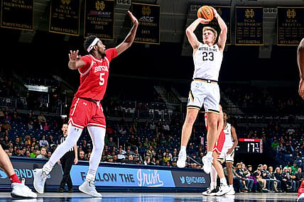 Dec 7, 2022; South Bend, Indiana, USA; Notre Dame Fighting Irish guard Dane Goodwin (23) shoots over Boston University Terriers guard Walter Whyte (5) in the first half at the Purcell Pavilion. Mandatory Credit: Matt Cashore-USA TODAY Sports