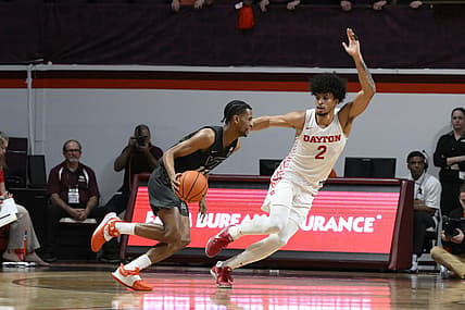 Dec 7, 2022; Blacksburg, Virginia, USA; Virginia Tech Hokies guard Darius Maddox (13) dribbles around Dayton Flyers forward Toumani Camara (2) in the first half at Cassell Coliseum. Mandatory Credit: Lee Luther Jr.-USA TODAY Sports