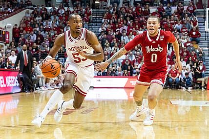 Dec 7, 2022; Bloomington, Indiana, USA; Indiana Hoosiers guard Tamar Bates (53) dribbles  the ball while Nebraska Cornhuskers guard C.J. Wilcher (0) defends in the first half at Simon Skjodt Assembly Hall. Mandatory Credit: Trevor Ruszkowski-USA TODAY Sports