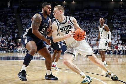Dec 7, 2022; University Park, Pennsylvania, USA; Penn State Nittany Lions guard/forward Myles Dread (2) defends as Michigan State Spartans forward Joey Hauser (10) drives the ball to the basket during the second half at Bryce Jordan Center. Michigan State defeated Penn State 67-58. Mandatory Credit: Matthew OHaren-USA TODAY Sports