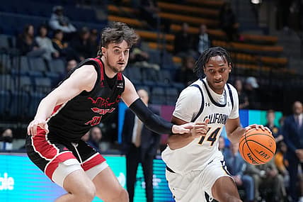 December 7, 2022; Berkeley, California, USA; California Golden Bears forward Grant Newell (14) dribbles the basketball against Eastern Washington Eagles forward Ethan Price (10) during the first half at Haas Pavilion. Mandatory Credit: Kyle Terada-USA TODAY Sports