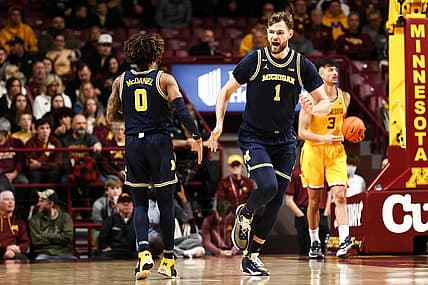Dec 8, 2022; Minneapolis, Minnesota, USA; Michigan Wolverines center Hunter Dickinson (1) reacts to his shot against the Minnesota Golden Gophers during the first half at Williams Arena. Mandatory Credit: Matt Krohn-USA TODAY Sports