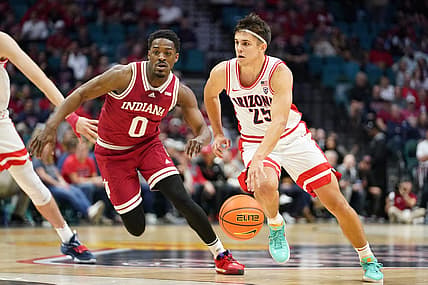 Dec 10, 2022; Las Vegas, Nevada, USA; Arizona Wildcats guard Kerr Kriisa (25) drives the ball against Indiana Hoosiers guard Xavier Johnson (0) during the first half at MGM Grand Garden Arena. Mandatory Credit: Lucas Peltier-USA TODAY Sports