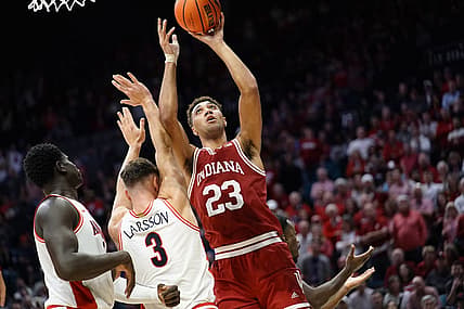 Dec 10, 2022; Las Vegas, Nevada, USA; Indiana Hoosiers forward Trayce Jackson-Davis (23) shoots the ball against Arizona Wildcats guard Pelle Larsson (3) and center Oumar Ballo (11) during the second half at MGM Grand Garden Arena. Mandatory Credit: Lucas Peltier-USA TODAY Sports