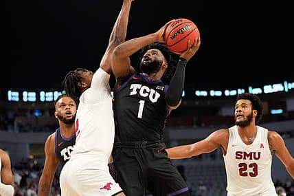 Dec 10, 2022; Fort Worth, Texas, USA;  TCU Horned Frogs guard Mike Miles Jr. (1) shoots the ball against Southern Methodist Mustangs guard Jalen Smith (2) during the first half at Dickies Arena. Mandatory Credit: Chris Jones-USA TODAY Sports
