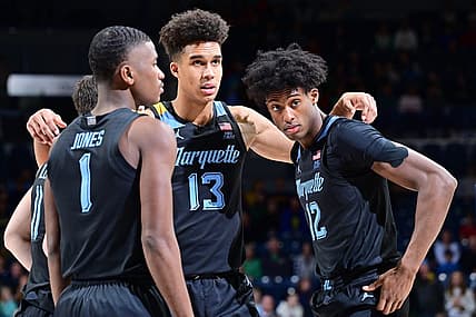 Dec 11, 2022; South Bend, Indiana, USA; Marquette Golden Eagles guard Kam Jones (1), forward Oso Ighodaro (13) and forward Olivier-Maxence Prosper (12) huddle before the game against the Notre Dame Fighting Irish at the Purcell Pavilion. Mandatory Credit: Matt Cashore-USA TODAY Sports