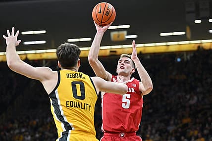 Dec 11, 2022; Iowa City, Iowa, USA; Wisconsin Badgers forward Tyler Wahl (5) shoots the ball over Iowa Hawkeyes forward Filip Rebraca (0) during the first half at Carver-Hawkeye Arena. Mandatory Credit: Jeffrey Becker-USA TODAY Sports