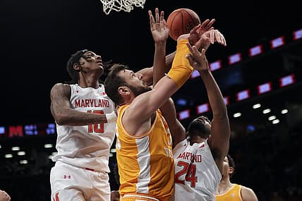 Dec 11, 2022; Brooklyn, New York, USA; Tennessee Volunteers forward Uros Plavsic (33), Maryland Terrapins forward Julian Reese (10) and Maryland Terrapins forward Donta Scott (24) fight for the ball during the first half of a game at Barclays Center. Mandatory Credit: Jessica Alcheh-USA TODAY Sports