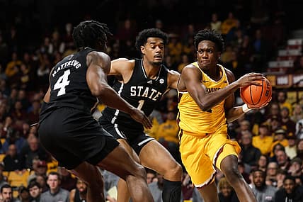 Dec 11, 2022; Minneapolis, Minnesota, USA; Minnesota Golden Gophers forward Joshua Ola-Joseph (1) looks to pass while Mississippi State Bulldogs forward Tolu Smith (1) and guard Cameron Matthews (4) defends during the first half at Williams Arena. Mandatory Credit: Matt Krohn-USA TODAY Sports