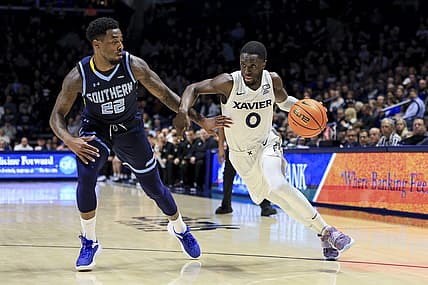 Dec 13, 2022; Cincinnati, Ohio, USA;  Southern University Jaguars guard Brion Whitley (22) defends as Xavier Musketeers guard Souley Boum (0) controls the ball in the first half at the Cintas Center. Mandatory Credit: Aaron Doster-USA TODAY Sports