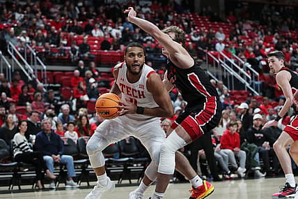 Dec 13, 2022; Lubbock, Texas, USA; Texas Tech Red Raiders forward Kevin Obanor (0) works the ball against Eastern Washington Eagles forward Casey Jones (31) in the first half at United Supermarkets Arena. Mandatory Credit: Michael C. Johnson-USA TODAY Sports