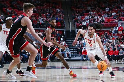 Dec 13, 2022; Lubbock, Texas, USA; Texas Tech Red Raiders guard Pop Isaacs (2) drives to the lane against Eastern Washington Eagles forward Dane Erikstrup (32) in the first half at United Supermarkets Arena. Mandatory Credit: Michael C. Johnson-USA TODAY Sports