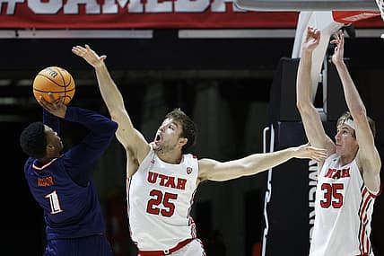 Dec 13, 2022; Salt Lake City, Utah, USA; Texas-San Antonio Roadrunners guard Japhet Medor (1) looks to shoot against Utah Utes guard Rollie Worster (25) and center Branden Carlson (35) at Jon M. Huntsman Center. Mandatory Credit: Jeffrey Swinger-USA TODAY Sports