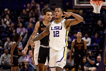 Dec 17, 2022; Baton Rouge, Louisiana, USA;  LSU Tigers forward KJ Williams (12) reacts to making a three point basket in the final minute of the game against the Winthrop Eagles during the second half at Pete Maravich Assembly Center. Mandatory Credit: Stephen Lew-USA TODAY Sports