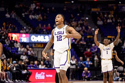 Dec 17, 2022; Baton Rouge, Louisiana, USA;  LSU Tigers forward KJ Williams (12) reacts to making a three point basket in the final minute of the game against the Winthrop Eagles during the second half at Pete Maravich Assembly Center. Mandatory Credit: Stephen Lew-USA TODAY Sports