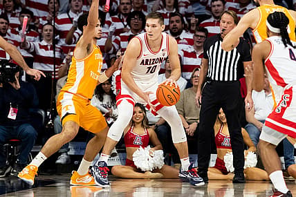 Dec 17, 2022; Tucson, Arizona, USA; Arizona Wildcats forward Azuolas Tubelis (10) drives to the net against Tennessee Volunteers forward Olivier Nkamhoua (13) during the first half at McKale Center. Mandatory Credit: Zachary BonDurant-USA TODAY Sports