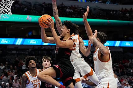 Dec 18, 2022; Dallas, Texas, USA;  Stanford Cardinal forward Spencer Jones (14) scores a basket past Texas Longhorns forward Christian Bishop (32) during the first half at American Airlines Center. Mandatory Credit: Chris Jones-USA TODAY Sports