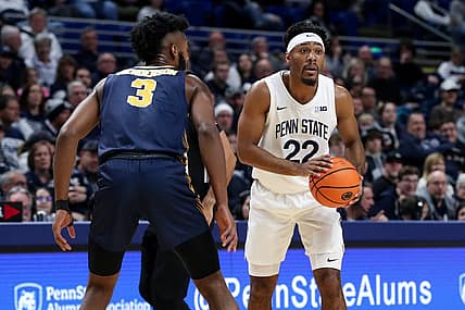 Dec 18, 2022; University Park, Pennsylvania, USA; Penn State Nittany Lions guard Jalen Pickett (22) holds the ball as Canisius Golden Griffins guard Jordan Henderson (3) defends during the first half at Bryce Jordan Center. Penn State defeated Canisius 97-67. Mandatory Credit: Matthew OHaren-USA TODAY Sports