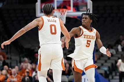 Dec 18, 2022; Dallas, Texas, USA;  Texas Longhorns forward Timmy Allen (0) and Texas Longhorns guard Marcus Carr (5) celebrates after a made basket against the Stanford Cardinal during the second half at American Airlines Center. Mandatory Credit: Chris Jones-USA TODAY Sports