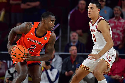Dec 18, 2022; Los Angeles, California, USA; Auburn Tigers forward Jaylin Williams (2) controls the ball against Southern California Trojans forward Kobe Johnson (0) during the first half at Galen Center. Mandatory Credit: Gary A. Vasquez-USA TODAY Sports