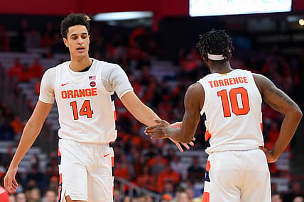 Dec 17, 2022; Syracuse, New York, USA; Syracuse Orange center Jesse Edwards (14) and guard Symir Torrence (10) reacts to a play against the Cornell Big Red during the second half at the JMA Wireless Dome. Mandatory Credit: Rich Barnes-USA TODAY Sports
