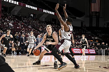 Dec 20, 2022; College Station, Texas, USA; Wofford Terriers center Kyler Filewich (14) drives as Texas A&M Aggies forward Julius Marble (34) defends during the first half at Reed Arena. Mandatory Credit: Maria Lysaker-USA TODAY Sports