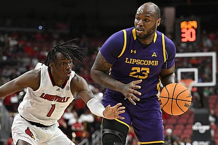 Dec 20, 2022; Louisville, Kentucky, USA; Louisville Cardinals guard Mike James (1) pressures the dribble of Lipscomb Bisons center Ahsan Asadullah (23) during the first half at KFC Yum! Center. Mandatory Credit: Jamie Rhodes-USA TODAY Sports