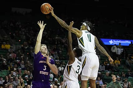 Dec 20, 2022; Waco, Texas, USA; Baylor Bears forward Jalen Bridges (11) blocks the shot of Northwestern State Demons guard Isaac Haney (3) during the first half at Ferrell Center. Mandatory Credit: Raymond Carlin III-USA TODAY Sports