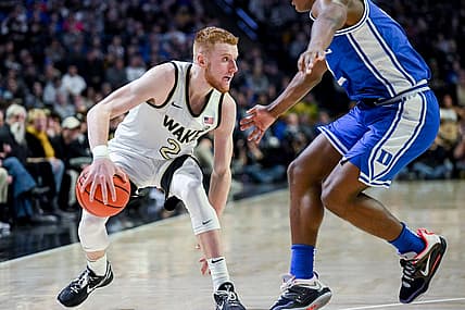 Dec 20, 2022; Winston-Salem, North Carolina, USA; Wake Forest Demon Deacons guard Cameron Hildreth (2) drives around Duke Blue Devils guard Jaylen Blakes (2) during the second half at Lawrence Joel Veterans Memorial Coliseum. Mandatory Credit: William Howard-USA TODAY Sports