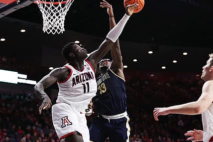 Dec 20, 2022; Tucson, Arizona, USA; Arizona Wildcats Center Oumar Ballo (11) blocks a shot from Montana State Bobcats Forward Jubrile Belo (13) in the first half at McKale Center. Mandatory Credit: Zachary BonDurant-USA TODAY Sports