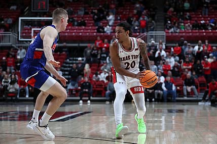 Dec 21, 2022; Lubbock, Texas, USA;  Texas Tech Red Raiders guard Jaylon Tyson (20) works the ball against Houston Christian Huskies guard Maks Klanjscek (13) in the first half at United Supermarkets Arena. Mandatory Credit: Michael C. Johnson-USA TODAY Sports