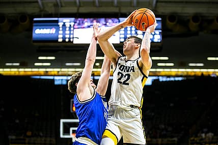 Iowa forward Patrick McCaffery (22) shoots a basket as Eastern Illinois guard Dan Luers defends during a NCAA men's basketball game, Wednesday, Dec. 21, 2022, at Carver-Hawkeye Arena in Iowa City, Iowa.

221221 Eastern Illinois Iowa Mbb 022 Jpg