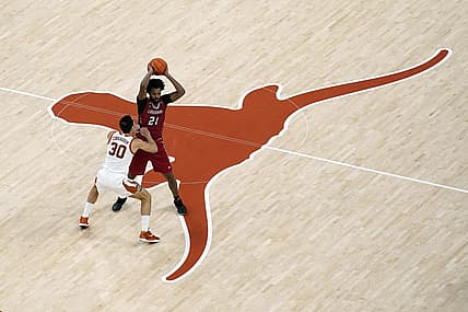 Dec 21, 2022; Austin, Texas, USA; Louisiana-Lafayette Ragin' Cajuns forward Jordan Brown (21) looks to pass the ball while defended by Texas Longhorns forward Brock Cunningham (30) during the second half at Moody Center. Mandatory Credit: Scott Wachter-USA TODAY Sports