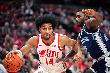 Dec 21, 2022; Columbus, Ohio, United States; Ohio State Buckeyes forward Justice Sueing (14) is defended by Maine Black Bears guard Ja'Shonte Wright-McLeish (2) during the first half of the NCAA division I basketball game at Value City Arena on Wednesday night. Mandatory Credit: Joseph Scheller-The Columbus Dispatch

Basketball Ceb Mbk Maine Maine At Ohio State