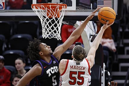 Dec 21, 2022; Salt Lake City, Utah, USA; TCU Horned Frogs forward Chuck O'Bannon Jr. (5) goes for the block on Utah Utes guard Gabe Madsen (55) in the first half at Vivint Arena. Mandatory Credit: Jeffrey Swinger-USA TODAY Sports