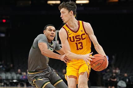 Dec 21, 2022; Phoenix, Arizona, USA; USC Trojans guard Drew Peterson (13) dribbles against Colorado State Rams guard John Tonje (1) during the first half at Footprint Center. Mandatory Credit: Joe Camporeale-USA TODAY Sports