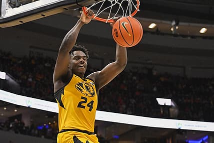 Dec 22, 2022; St. Louis, Missouri, USA;  Missouri Tigers guard Kobe Brown (24) dunks against the Illinois Fighting Illini during the first half at Enterprise Center. Mandatory Credit: Jeff Curry-USA TODAY Sports