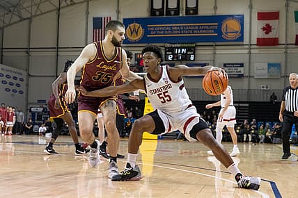 Dec 22, 2022; Santa Cruz, California, USA;  Stanford Cardinal forward Harrison Ingram (55) controls the ball during the first half against Loyola Ramblers center Bryce Golden (35) at Kaiser Permanente Arena. Mandatory Credit: Stan Szeto-USA TODAY Sports