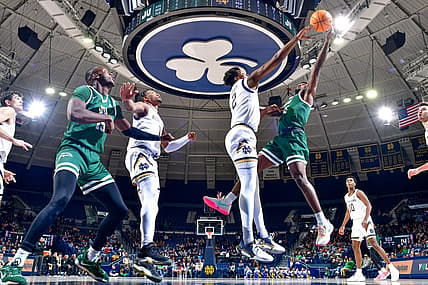 Dec 27, 2022; South Bend, Indiana, USA; Notre Dame Fighting Irish forward Ven-Allen Lubin (2) blocks the shot attempt by Jacksonville Dolphins guard Jordan Davis (11) in the first half at the Purcell Pavilion. Mandatory Credit: Matt Cashore-USA TODAY Sports
