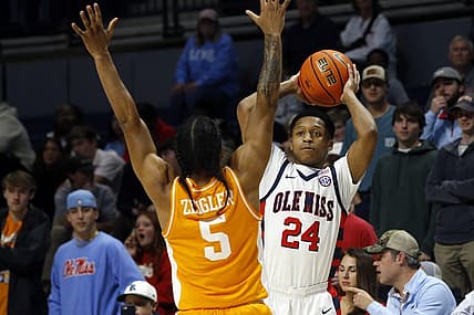 Dec 28, 2022; Oxford, Mississippi, USA; Mississippi Rebels guard Daeshun Ruffin (24) passes the ball against Tennessee Volunteers guard Zakai Zeigler (5) during the first half at The Sandy and John Black Pavilion at Ole Miss. Mandatory Credit: Petre Thomas-USA TODAY Sports
