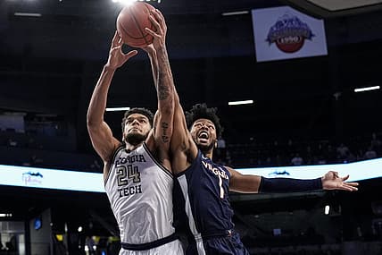 Dec 31, 2022; Atlanta, Georgia, USA; Georgia Tech Yellow Jackets center Rodney Howard (24) and Virginia Cavaliers forward Jayden Gardner (1) battle for the ball during the first half at McCamish Pavilion. Mandatory Credit: Dale Zanine-USA TODAY Sports