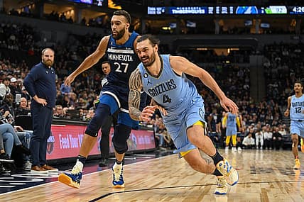 Nov 30, 2022; Minneapolis, Minnesota, USA;  Minnesota Timberwolves center Rudy Gobert (27) and Memphis Grizzlies center Steven Adams (4) race after a loose ball during the fourth quarter at Target Center. Mandatory Credit: Nick Wosika-USA TODAY Sports