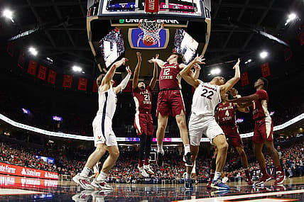 Dec 3, 2022; Charlottesville, Virginia, USA; Florida State Seminoles guard Cam'Ron Fletcher (21) and Seminoles guard Tom House (12) battle for a rebound with Virginia Cavaliers forward Ben Vander Plas (5) and Cavaliers center Francisco Caffaro (22) in the first half at John Paul Jones Arena. Mandatory Credit: Geoff Burke-USA TODAY Sports
