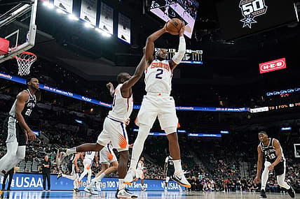 Dec 4, 2022; San Antonio, Texas, USA;  Phoenix Suns forward Josh Okogie (2) rebounds in the second half against the San Antonio Spurs at the AT&T Center. Mandatory Credit: Daniel Dunn-USA TODAY Sports
